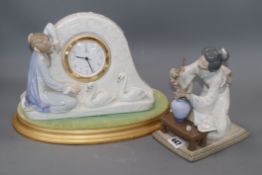 A Lladro clock on base and a Japanese figure