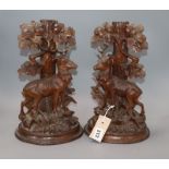 A pair of 19th century Black Forest stag carvings height 32cm