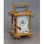 A Chinese reproduction enamel bamboo carriage clock