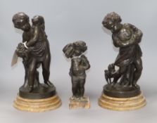 A pair of bronze figures of cherubs and another smaller tallest 30cm