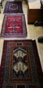 Three Belouch rugs 142 x 88cm, 149 x 88cm and 148 x 80cm