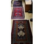 Three Belouch rugs 142 x 88cm, 149 x 88cm and 148 x 80cm