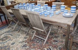 A wooden table with five dining chairs and one wooden steamer chair L.270cm