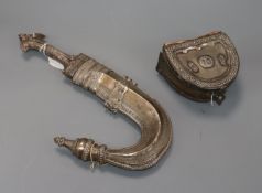 A Middle Eastern white metal jambiya and similar pouch