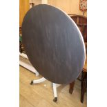 A painted circular dining table W.128cm