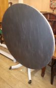 A painted circular dining table W.128cm