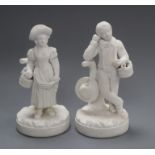 A pair of Derby biscuit figures of a standing boy and girl, c.1800-10, each holding a basket of