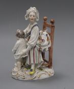 A Vienna style figure of a mother and child height 17.5cm