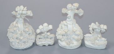 Four Staffordshire miniature biscuit groups of a shepherd and sheep, two deer and two sheep under