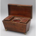 A Regency mahogany sarcophagus tea caddy