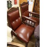 A pair of Victorian oak library chairs