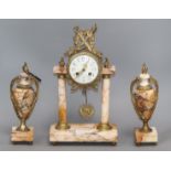A Louis XVI style Sienna marble clock garniture