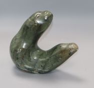 A signed inuit soapstone carving of a seal height 22cm