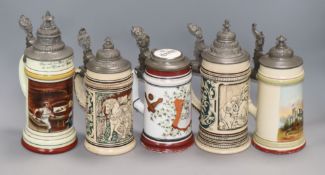 A collection of five pewter mounted beer steins