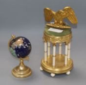 An onyx and gilt metal portico desk piece and hardstone globe