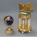 An onyx and gilt metal portico desk piece and hardstone globe