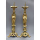 A pair of ormolu pricket candlesticks height 65cm