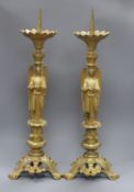 A pair of ormolu pricket candlesticks height 65cm