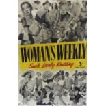 A Womans Weekly tin advertising sign