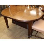 An Edwardian mahogany D-end extending dining table with two leaves length 137cm