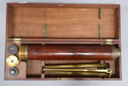 A cased astronomical telescope by Gilbert & Gilkerson, Tower Hill, London, with spare lenses and