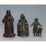 A bronze bell, a bronze monk and a child with a dog tallest 13cm