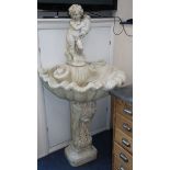A reconstituted stone fountain on pedestal H.157cm