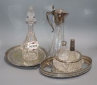 A cut glass bowl with a silver rim, a plated mounted glass claret jug, a glass decanter and sundry
