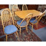 An Ercol elm drop leaf dining table and six Ercol chairs L.138cm