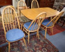 An Ercol elm drop leaf dining table and six Ercol chairs L.138cm
