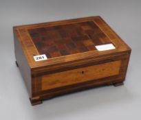 A 19th century rosewood and mahogany satinwood sewing box