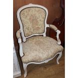 A Louis XVI style painted elbow chair