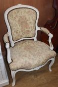 A Louis XVI style painted elbow chair