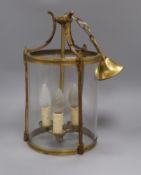 A brass and glass hall lantern