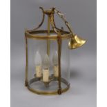 A brass and glass hall lantern