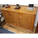 An Ercol elm sideboard W.114cm