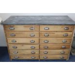 A Victorian zinc top pine twelve drawer chest W.141cm