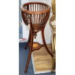 An Edwardian mahogany jardiniere stand W.53cm