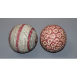 Two carpet bowls