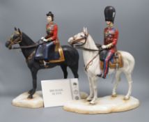 A pair of Michael Sutty models of The Queen and Prince Philip trooping the colour for the silver