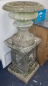 A small reconstituted stone urn on pedestal H.132cm