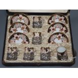 A Royal Crown Derby cased coffee set with silver mounts