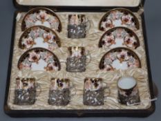 A Royal Crown Derby cased coffee set with silver mounts