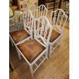 A set of six painted dining chairs