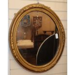 A 19th century oval gilt gesso mirror