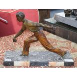An Art Deco patinated bronze figure of a boules player, signed "Limousin", length 41cm