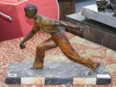 An Art Deco patinated bronze figure of a boules player, signed "Limousin", length 41cm