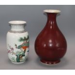 A Chinese famille rose peacock vase and a 19th century Chinese copper red glazed vase, 18th / 19th