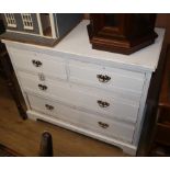 A washed chest of drawers with brass handles W.105cm