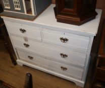 A washed chest of drawers with brass handles W.105cm
